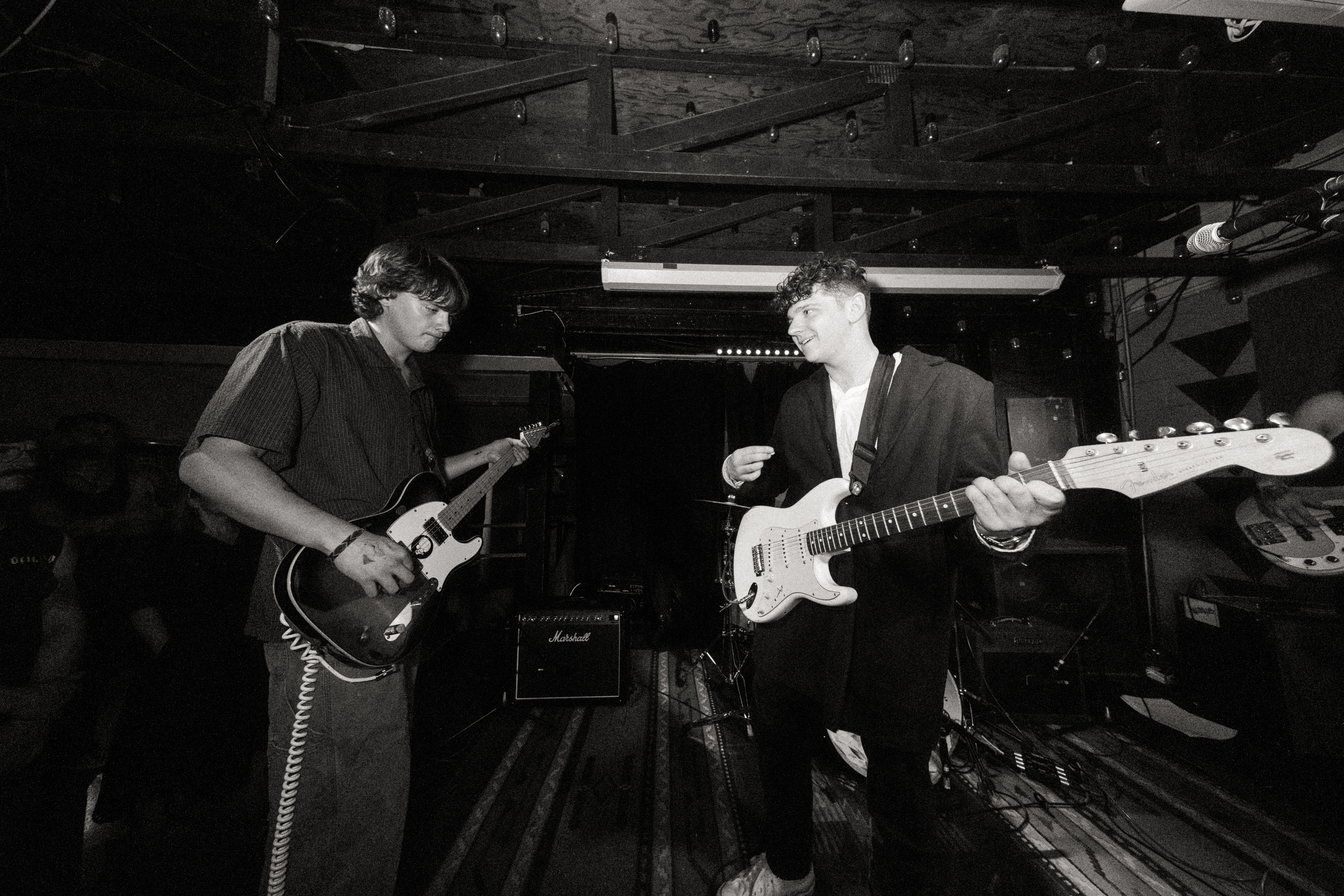 Etiquette performing as a full band on stage